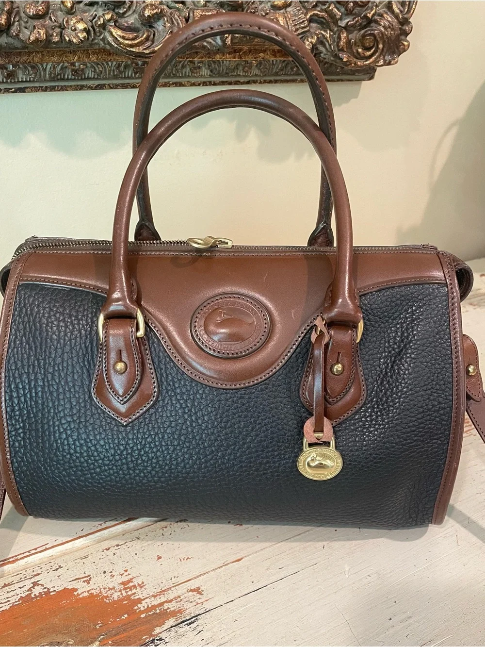 Dooney & Bourke vintage AWL Black and Brown Pebbled Leather Satchel / crossbody